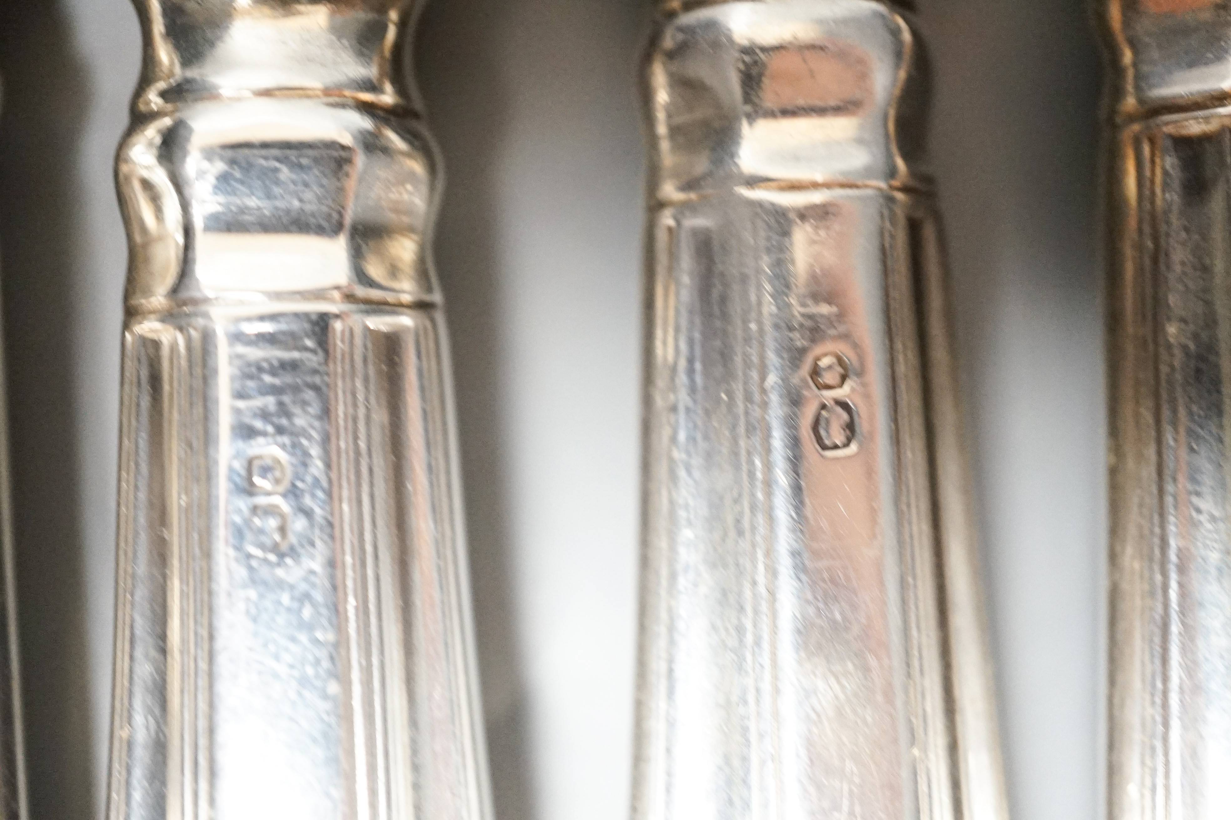 A set of six modern silver handled steel Kings pattern table knives and six matching dessert knives, A. Haviland Nye, Sheffield, 1973.